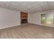 Spacious basement with brick fireplace, sliding glass door to the backyard at 1040 Spring Dr, Gastonia, NC 28052