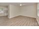 Spacious bedroom with neutral walls, plank flooring, and a ceiling fan at 1040 Spring Dr, Gastonia, NC 28052