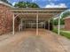Long carport has metal awning and room for several vehicles at 1040 Spring Dr, Gastonia, NC 28052