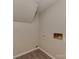 A gray laundry room with wood-look vinyl floors and washer/dryer hookups at 1040 Spring Dr, Gastonia, NC 28052