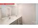 Bathroom features a double sink vanity with tile floors and a large mirror at 11132 Cardinal Creek Ave, Charlotte, NC 28215