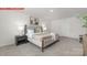 Comfortable bedroom showcasing a stylish bed, soft carpet, and soothing decor at 11132 Cardinal Creek Ave, Charlotte, NC 28215