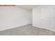 Neutral-toned bedroom with carpeted floor, two doors, and ample space at 11132 Cardinal Creek Ave, Charlotte, NC 28215