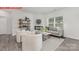 Inviting living room with modern furnishings, a fireplace, and a large window at 11132 Cardinal Creek Ave, Charlotte, NC 28215