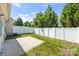 Backyard featuring concrete patio, green grass and a tall privacy fence at 12009 Elizabeth Madison Ct, Charlotte, NC 28277
