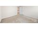 Neutral bedroom with carpeted floors and closet space at 12009 Elizabeth Madison Ct, Charlotte, NC 28277