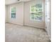 Cozy bedroom features soft carpet, natural light, and closet at 12009 Elizabeth Madison Ct, Charlotte, NC 28277