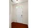 Welcoming entryway features a white door with a window, overhead light, and hardwood floors at 12009 Elizabeth Madison Ct, Charlotte, NC 28277