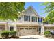 Inviting townhouse showcases charming architectural details and a convenient two-car garage at 12009 Elizabeth Madison Ct, Charlotte, NC 28277