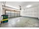 Spacious garage with plenty of room for storage, and overhead door with windows at 12009 Elizabeth Madison Ct, Charlotte, NC 28277
