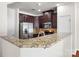 Beautiful kitchen featuring a breakfast bar with granite countertops and stainless steel appliances at 12009 Elizabeth Madison Ct, Charlotte, NC 28277