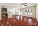 Spacious living room features hardwood floors, a ceiling fan, and lots of natural light at 12009 Elizabeth Madison Ct, Charlotte, NC 28277
