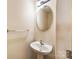 Cozy powder room featuring a pedestal sink and light fixture at 12009 Elizabeth Madison Ct, Charlotte, NC 28277
