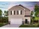 Two-story home featuring stone accents, white garage door, neutral siding and landscaped front yard at 1228 Hallman Branch Ln, Lincolnton, NC 28092