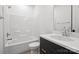 Modern bathroom with a sleek vanity and shower-tub combo at 13618 Tranquil Day Dr, Matthews, NC 28105
