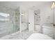 Bathroom with marble floors, white cabinets, a shower, and a freestanding tub at 13618 Tranquil Day Dr, Matthews, NC 28105