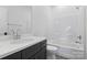 Modern bathroom with a sleek vanity and shower-tub combo at 13618 Tranquil Day Dr, Matthews, NC 28105