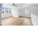 Bright bedroom with hardwood floors and multiple windows at 13618 Tranquil Day Dr, Matthews, NC 28105