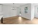 Dining room with wood floors, recessed lighting, and views of the backyard at 13618 Tranquil Day Dr, Matthews, NC 28105