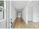 Bright foyer featuring hardwood floors and a view into the open-concept living spaces at 13618 Tranquil Day Dr, Matthews, NC 28105