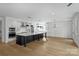 Spacious open kitchen featuring a large island, white cabinets, and stainless steel appliances at 13618 Tranquil Day Dr, Matthews, NC 28105