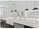 Bright open kitchen with large island featuring marble countertop, stainless steel appliances, and pendant lights at 13618 Tranquil Day Dr, Matthews, NC 28105