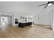 Open kitchen with a large center island, modern appliances, and hardwood floors at 13618 Tranquil Day Dr, Matthews, NC 28105