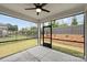 Screened-in patio with backyard view featuring a grassy lawn, fence and professional landscaping at 13618 Tranquil Day Dr, Matthews, NC 28105