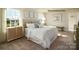 Comfortable bedroom with a luxurious bed, side tables, and natural light at 1415 5Th Street Ne Dr, Hickory, NC 28601