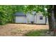 View of the back of the house and backyard showcasing new vinyl siding and new air conditioning unit at 1440 10Th Sw Ave, Hickory, NC 28602