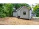 View of the home's exterior and back yard, complete with an air conditioning unit at 1440 10Th Sw Ave, Hickory, NC 28602