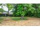 Backyard featuring grass and a tree with leafy foliage at 1440 10Th Sw Ave, Hickory, NC 28602