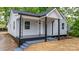 Inviting home with covered porch, decorative iron supports, and fresh exterior paint at 1440 10Th Sw Ave, Hickory, NC 28602