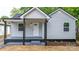 Charming home featuring a covered front porch and well-manicured landscaping at 1440 10Th Sw Ave, Hickory, NC 28602