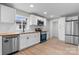 Modern kitchen features stainless steel appliances, wood countertops, and ample cabinet space at 1440 10Th Sw Ave, Hickory, NC 28602