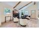 Inviting living room featuring natural light, a fireplace, and modern decor at 1515 Edgewater Dr, Charlotte, NC 28210
