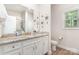 Bright bathroom features granite counters, white cabinets, and glass enclosed shower at 160 Tanner Loop, Troutman, NC 28166