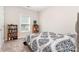 Carpeted bedroom with bookcase and window at 160 Tanner Loop, Troutman, NC 28166
