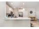 Airy kitchen with white cabinets, stainless appliances, granite countertops, and hardwood floors at 160 Tanner Loop, Troutman, NC 28166