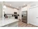 Bright eat-in kitchen features white cabinets, stainless appliances, stone countertops, and hardwood floors at 160 Tanner Loop, Troutman, NC 28166