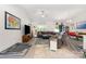 Spacious living room with a large sectional sofa, modern flooring, and a ceiling fan at 160 Tanner Loop, Troutman, NC 28166