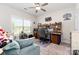 Bright office featuring a ceiling fan, a large window, and a built-in desk with shelving at 160 Tanner Loop, Troutman, NC 28166