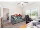 Bright office showcasing a comfortable couch and a built-in wooden desk with plenty of sunshine at 160 Tanner Loop, Troutman, NC 28166
