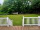 View of the backyard from the deck; large green space for outdoor activities at 165 Kimball Rd, China Grove, NC 28023