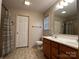 Functional bathroom with double sink vanity, vinyl flooring, and large mirror at 165 Kimball Rd, China Grove, NC 28023