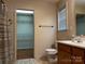 Bathroom with a vanity, toilet, shower with shower curtain, towel rack and closet/shelving unit at 165 Kimball Rd, China Grove, NC 28023