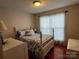 Bright bedroom with queen bed, soft bedding, and natural light from the window at 165 Kimball Rd, China Grove, NC 28023