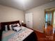 Comfortable bedroom with queen bed, bedside table, and direct access to the hall and bathroom at 165 Kimball Rd, China Grove, NC 28023
