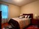 Inviting bedroom with queen bed, soft bedding, and natural light from the window at 165 Kimball Rd, China Grove, NC 28023