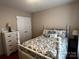 Comfortable bedroom with queen bed, bedside table, and lots of storage at 165 Kimball Rd, China Grove, NC 28023